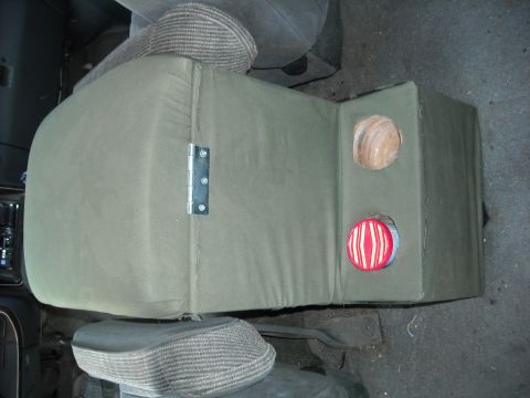 1990 Ford C-150 (Centurion Conversions) - Custom center console with speaker cutouts and a hinged side panel.