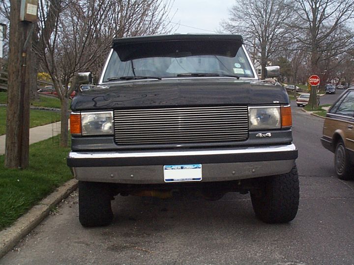 Black Ford Bronco front view, aftermarket grille, 4x4 badge, license plate visible