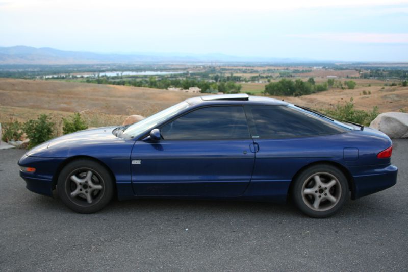 Blue 1995 Ford Probe coupe, side view, with sunroof and tinted windows