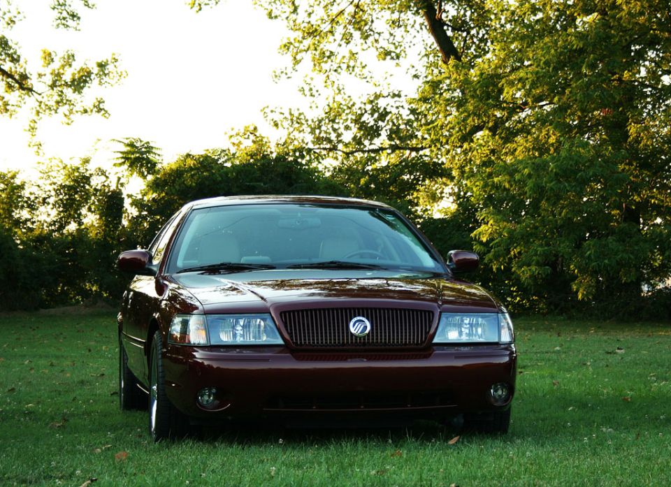 2003 Mercury Marauder front view parked on grass with trees in background
