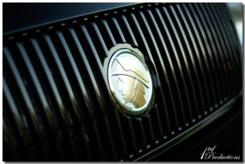 2003 Mercury Marauder - The iconic Mercury emblem is centered on the vertical bar grille of the vehicle.