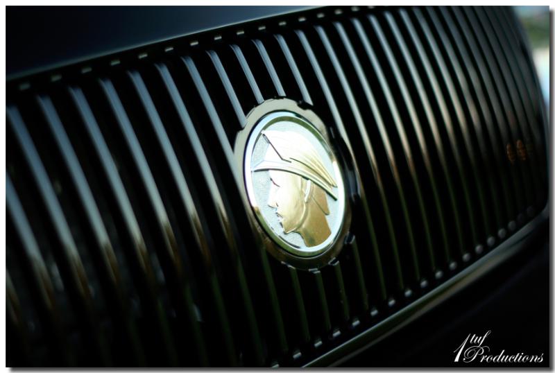 Close-up of the Mercury emblem on the grille of a 2003 Mercury Marauder
