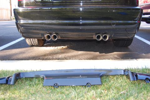 2002 BMW M3 - 2002 BMW M3 rear bumper and CSL diffuser. The diffuser is separate and placed on the grass.