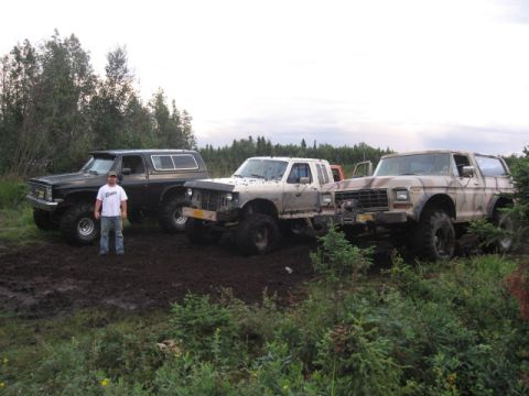 1990 Ford F-250 - Three trucks are stuck in the mud after an off-road excursion.