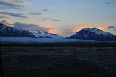 1990 Chevrolet Suburban - Mountain range and glacier at sunset, with a rocky foreground.