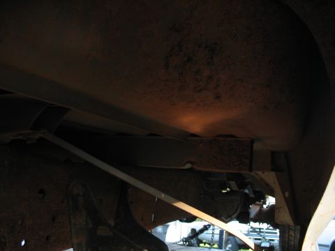 1988 Ford E250 - The interior of a vehicle is visible, showing dark paneling and some overhead lighting.