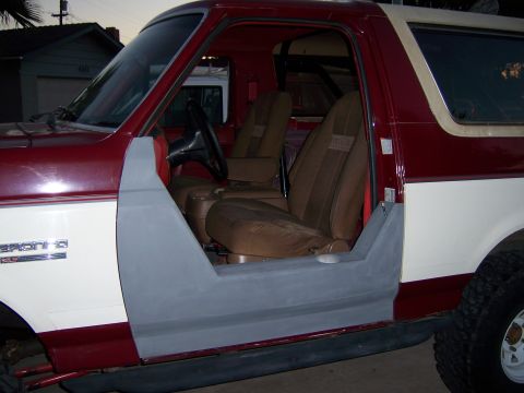 1991 Ford Bronco - This 1991 Ford Bronco is shown with its driver's side door removed, revealing the interior and a project in progress.