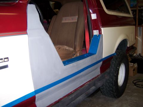 1991 Ford Bronco - Bodywork in progress on a 1991 Ford Bronco, focusing on the side panel and door area.