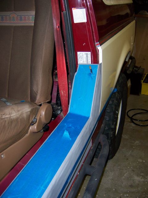 1991 Ford Bronco - Interior view of a 1991 Ford Bronco with a partially installed blue panel on the door frame.