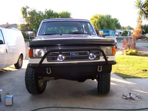 1991 Ford Bronco - Front view of a 1991 Ford Bronco, modified with an aftermarket bumper and auxiliary lights.