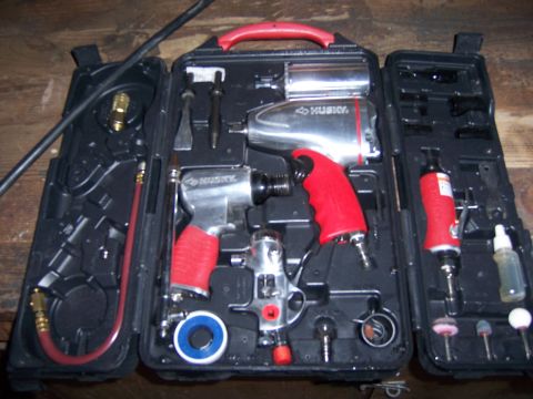 1991 Ford Bronco - A Husky air tool kit is neatly organized in its case, an impact wrench, air ratchet, and various grinding attachments.