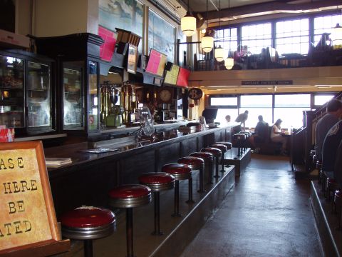1992 Ford Taurus - Interior view of a diner with a counter, stools, and booths.