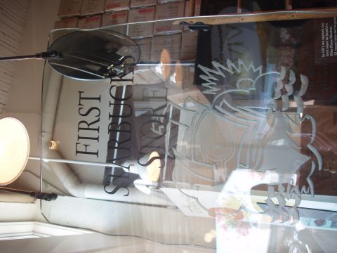 1992 Ford Taurus - Glass sign with Starbucks logo and text, likely from the first store.