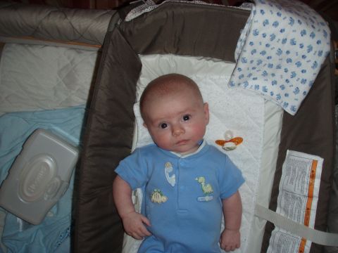 1997 Ford F-250 - A baby rests in a bassinet, complete with a pacifier and a wipe container nearby.