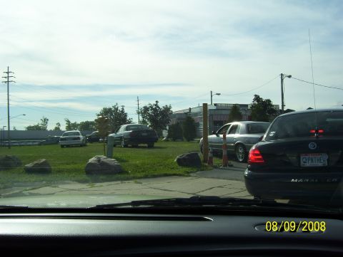 2008 Ford Crown Victoria - Multiple vehicles are visible in a parking lot on a sunny day, with a date stamp of 08/09/2008.