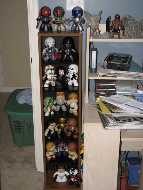 1991 Ford Bronco - Star Wars figures are displayed on shelves, with a green laundry bin visible to the left.