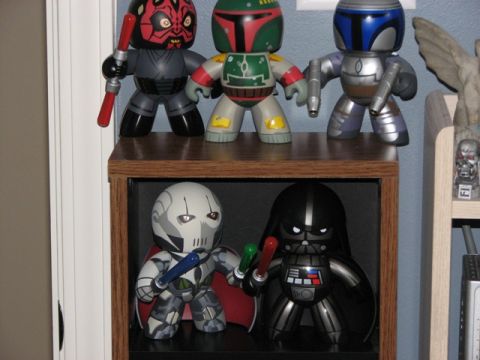 1991 Ford Bronco - Several Star Wars character figures are displayed on shelves, some holding lightsabers.