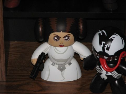 1991 Ford Bronco - Two collectible figures, Princess Leia and Venom, are displayed on a shelf.