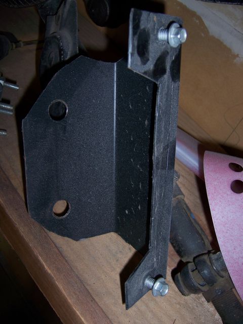 1991 Ford Bronco - A close-up view of a metal bracket with hardware, likely a replacement part.