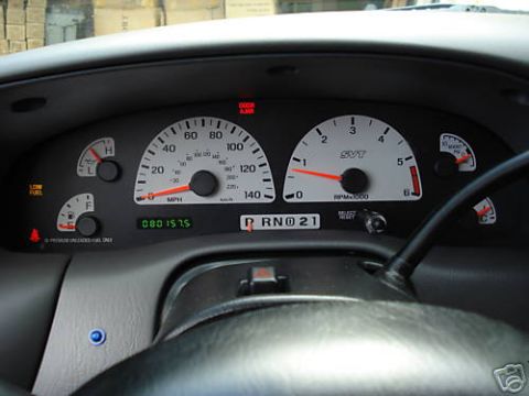 2007 Ford Mustang - The dashboard displays the speedometer, tachometer, fuel gauge, and gear selector in a vehicle's interior.