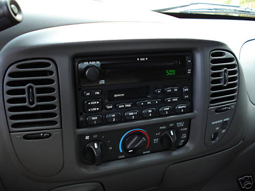 Car interior dashboard with radio and climate controls