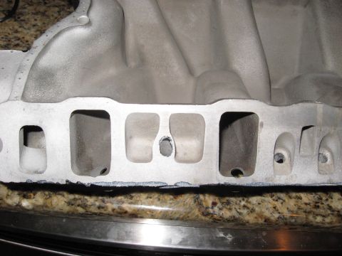 1991 Ford Bronco - Close-up view of an aluminum intake manifold, showing its internal structure and ports.