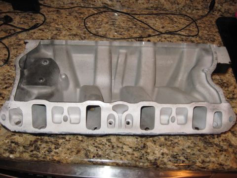 1991 Ford Bronco - Aluminum intake manifold with eight ports, likely for a V8 engine.