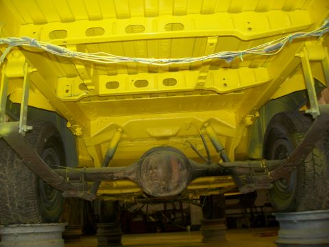 1970 Ford Ranchero - Undercarriage of a vehicle, showing the rear axle and suspension system.