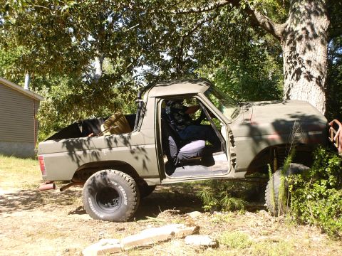 1980 Ford Bronco - This 1980 Ford Bronco is seen parked outdoors with its driver's door open and a person seated inside.