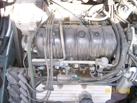 1995 Mercury Grand Marquis - Close-up view of an engine bay, showing various components and wiring. Date stamp indicates 2008.