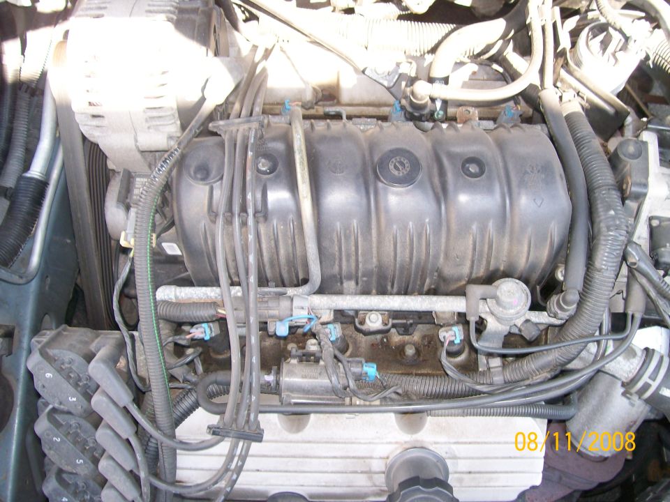 Engine bay with alternator, intake manifold, and spark plug wires visible. Date stamp reads 08/11/2008