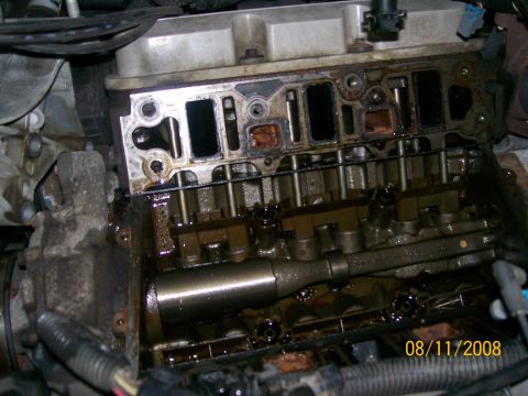 1995 Mercury Grand Marquis - Close-up view of an engine after the intake manifold has been removed, revealing internal components.