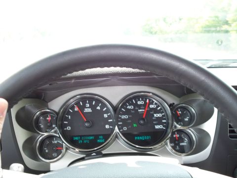 1996 Ford Bronco - The interior of a vehicle shows the dashboard with a steering wheel and gauges. The speedometer indicates a speed of 60 MPH and the tachome…