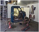 2007 Ford Mustang - Photograph of a truck cab during restoration in a workshop, not a technical document.