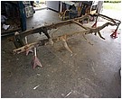 2007 Ford Mustang - Photograph of a stripped truck frame and suspension, not a technical document.