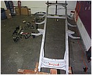 2007 Ford Mustang - Photograph of truck body panels and parts during restoration, not a technical document.