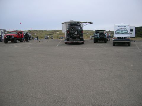 1996 Ford Bronco - A silver 1990s Ford F-150 pickup truck is parked in a lot with other vehicles and trailers. The truck is facing the camera and is clean and…