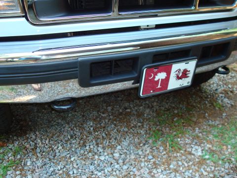 1992 Ford Bronco - Close-up of the front bumper and grille of a 1992 Ford Bronco, a South Carolina license plate.