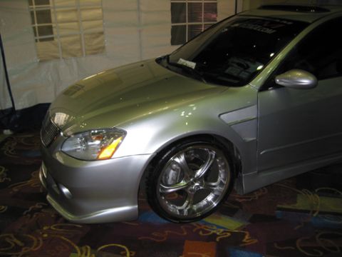 2002 Nissan Altima - This silver 2002 Nissan Altima features a custom body kit and aftermarket wheels.