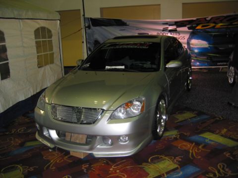 2002 Nissan Altima - Front view of a silver 2002 Nissan Altima at a car show.