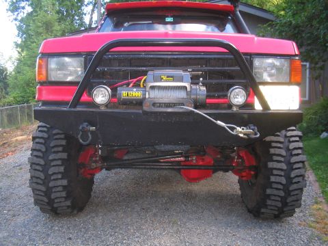 1989 Ford Bronco - This modified SUV features aggressive off-road tires and a heavy-duty front bumper with a winch.