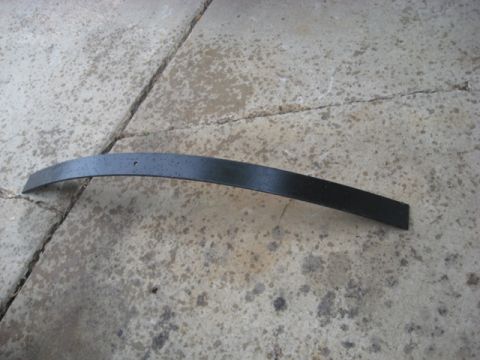 1996 Ford Bronco - A black leaf spring is shown lying on a concrete surface, with a watermark for Supermotors.net visible at the bottom right.