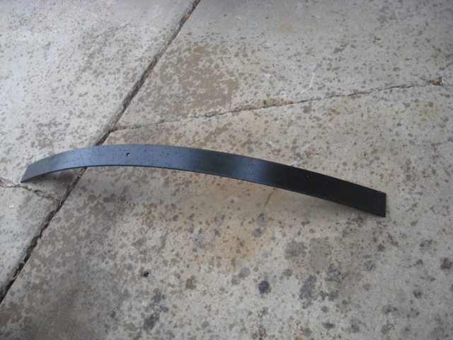 Black leaf spring on concrete