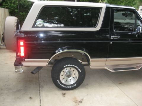 1996 Ford Bronco - Side view of a Ford Bronco, a spare tire and BFGoodrich tires.
