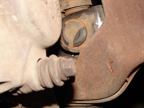1996 Ford Bronco - Detail shot of a vehicle's undercarriage, focusing on suspension and brake parts.