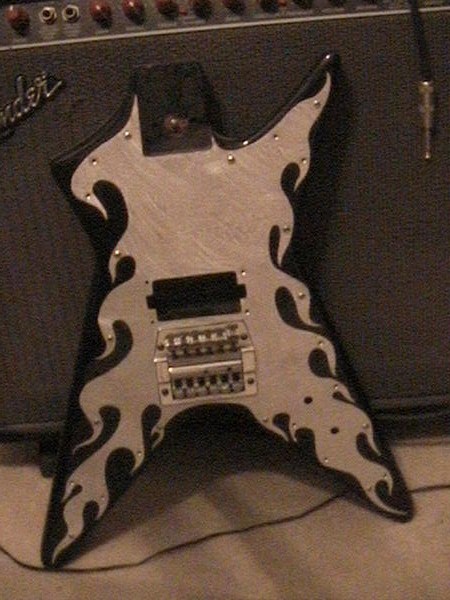 1978 Ford Bronco - This electric guitar features a striking flame graphic design on its body, set against a dark background.