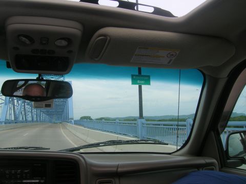 1996 Ford Bronco - Driving across a bridge with a sign indicating the Mississippi River, viewed from inside the vehicle.