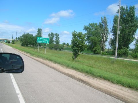 1996 Ford Bronco - Green highway sign indicates directions to Fairmont and Albert Lea.
