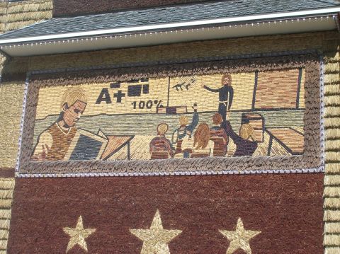 1996 Ford Bronco - A mural depicts a classroom scene with students and a teacher, showing academic achievement.