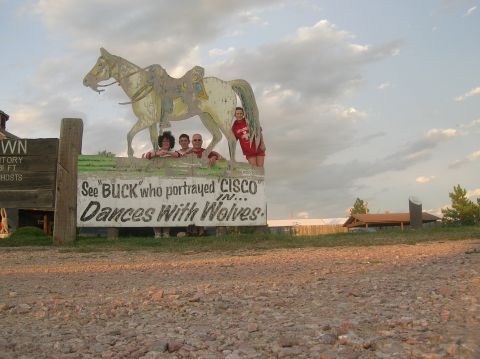 1996 Ford Bronco - A group poses with a cutout horse and a sign that reads 'See BUCK who portrayed CISCO in... Dances With Wolves.'